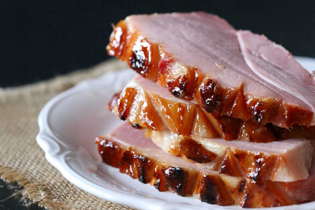 Pineapple bourbon glazed ham on a platter