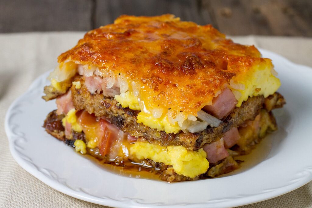 Breakfast lasagna with sausage, ham, and hash browns