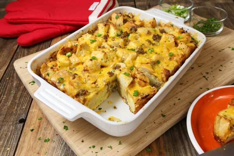 Cheesy sausage breakfast casserole with sourdough bread and cheddar cheese