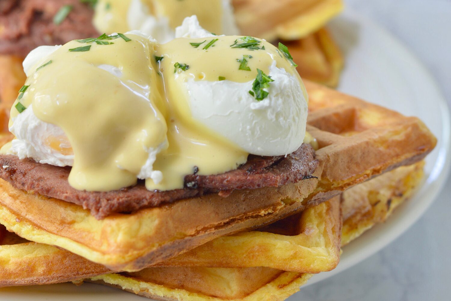 Waffle Benedict with Braunschweiger and poached eggs