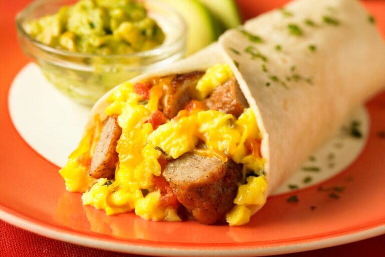 Southwest Breakfast Wraps with eggs, sausage links, cheese, and salsa.