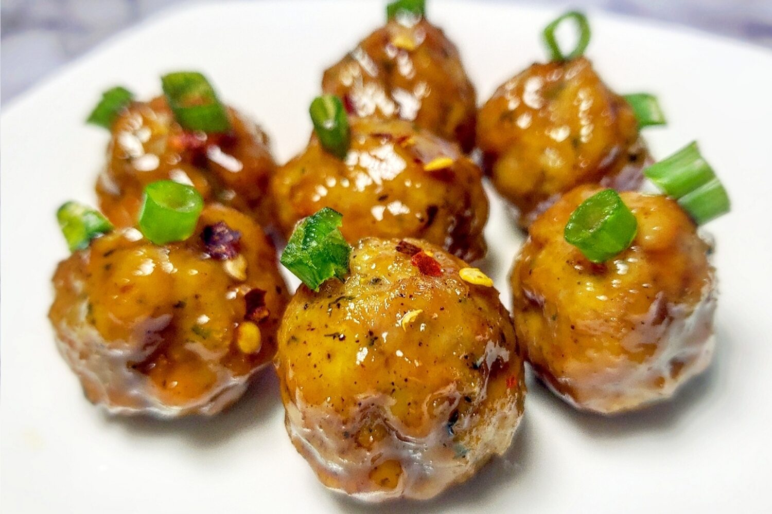 Jalapeno Glazed Meatballs with scallions