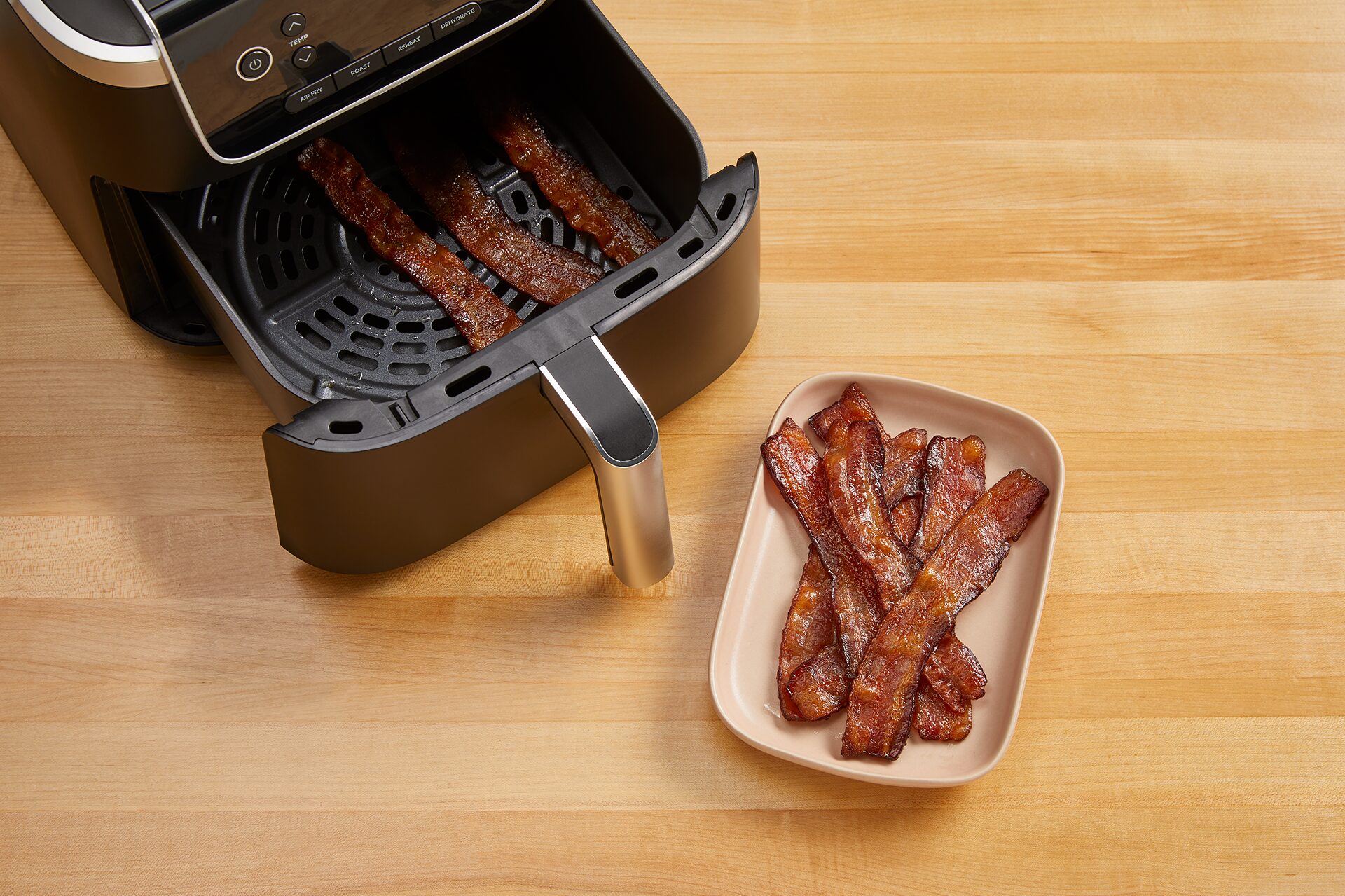 Bacon on a plate and bacon being cooked in an air fryer