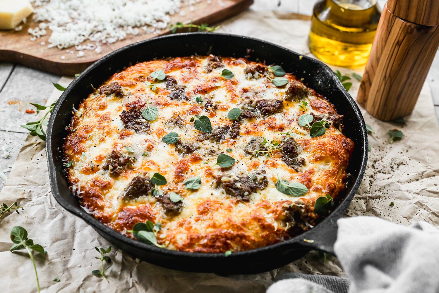 Sausage pizza in a cast iron skillet