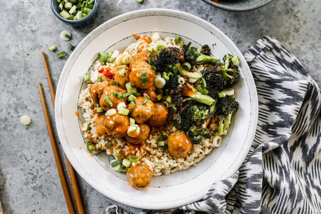 Bang Bang chicken meatballs served with broccoli over rice