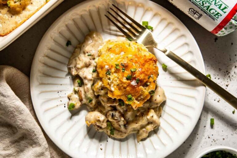 A plate and fork with Biscuits & Sausage Gravy Casserole.