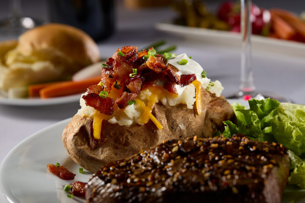 Loaded baked potatoes with sour cream and bacon