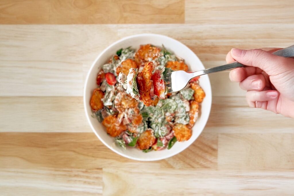 A bowl of crispy BLT potato salad.