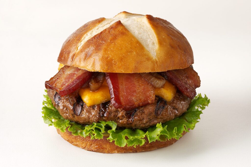 Bacon Beer Burger with cheese, lettuce, and onions