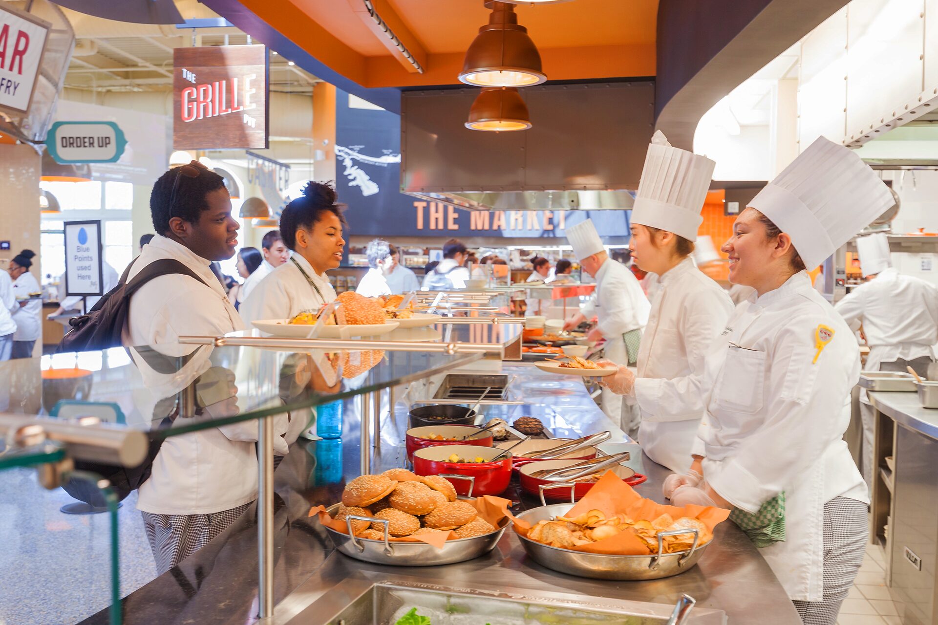 Chefs serving guests food