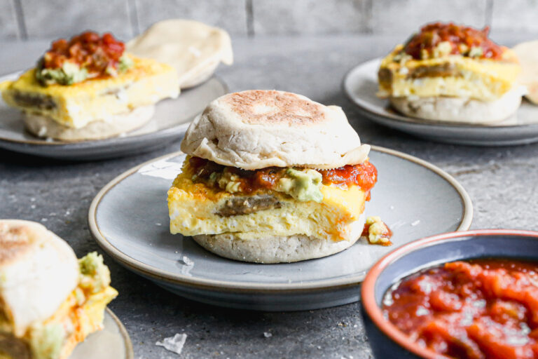 Breakfast sandwich with sausage, avocado, pepper jack cheese, and jalapeno cream cheese